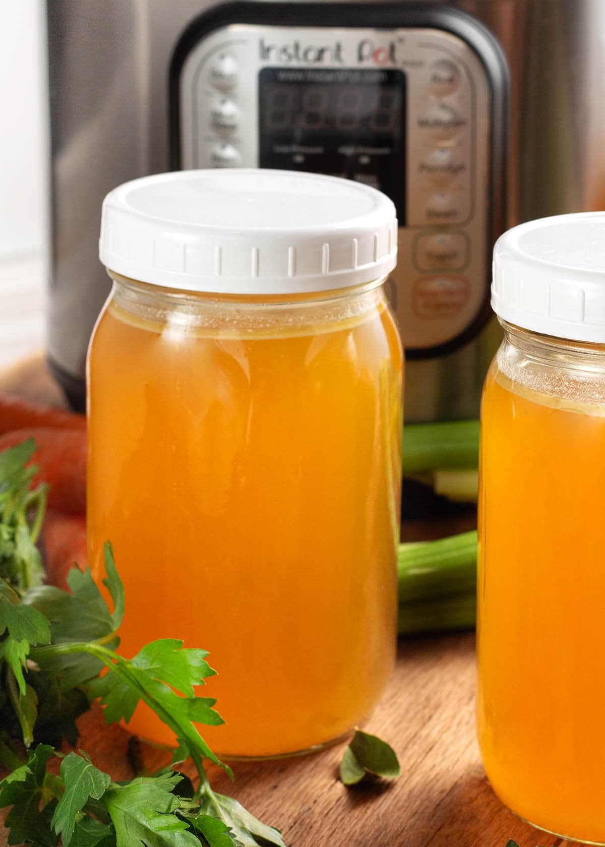 Instant Pot Turkey Broth in jars in front of an IP
