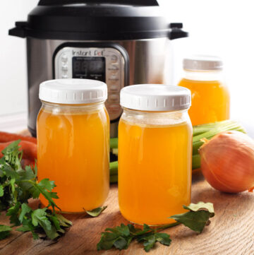 Instant Pot Turkey Broth in jars in front of IP