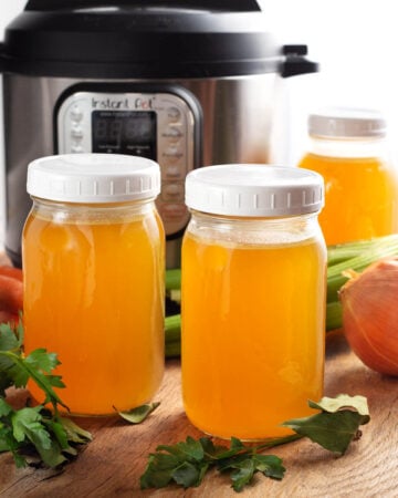 Instant Pot Turkey Broth in jars in front of IP