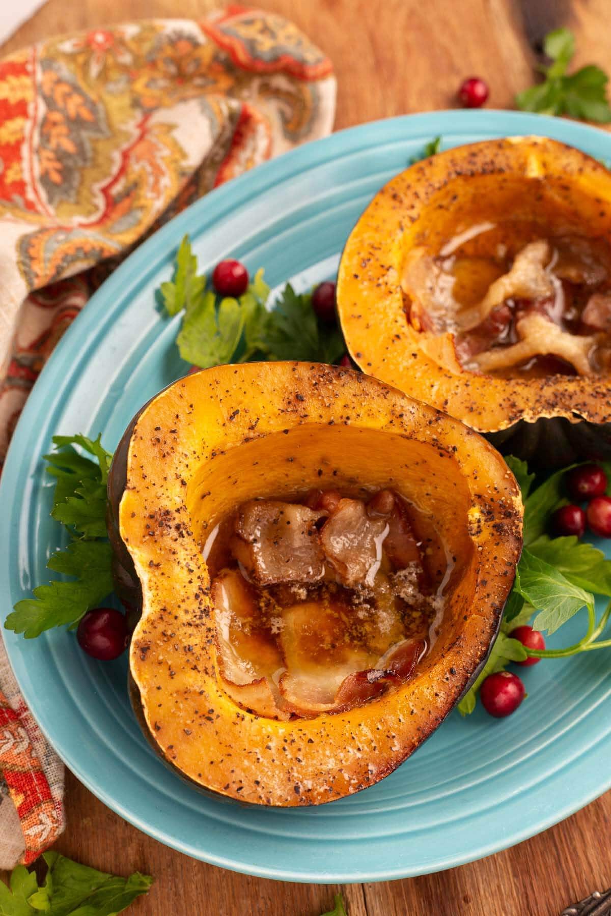 Slow Cooker Acorn Squash halves on a blue plate