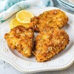 3 pieces of Air Fryer Parmesan Crusted Chicken on a white plate