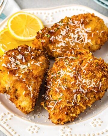 Air Fryer Parmesan Crusted Chicken on a white plate