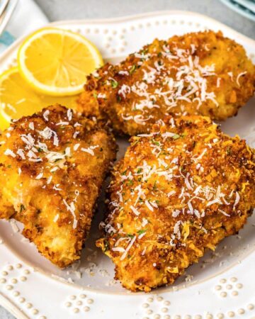 Air Fryer Parmesan Crusted Chicken on a white plate