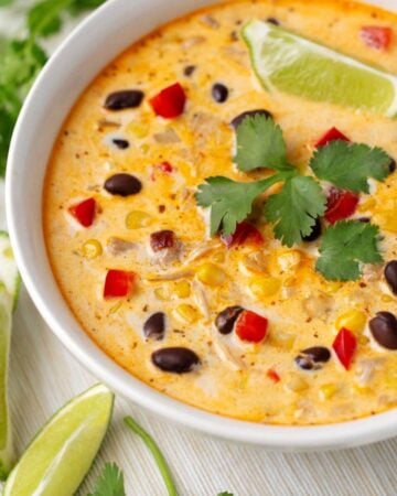 corn soup in a white bowl closeup.