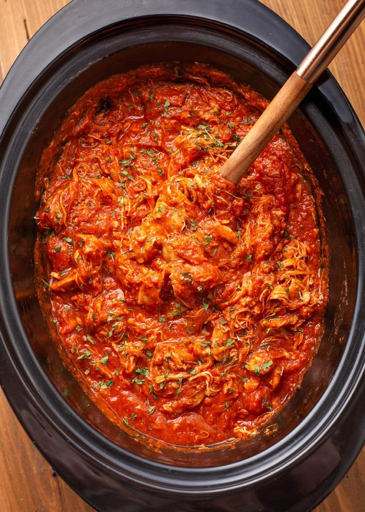 Slow Cooker Chicken Cacciatore in a black crock