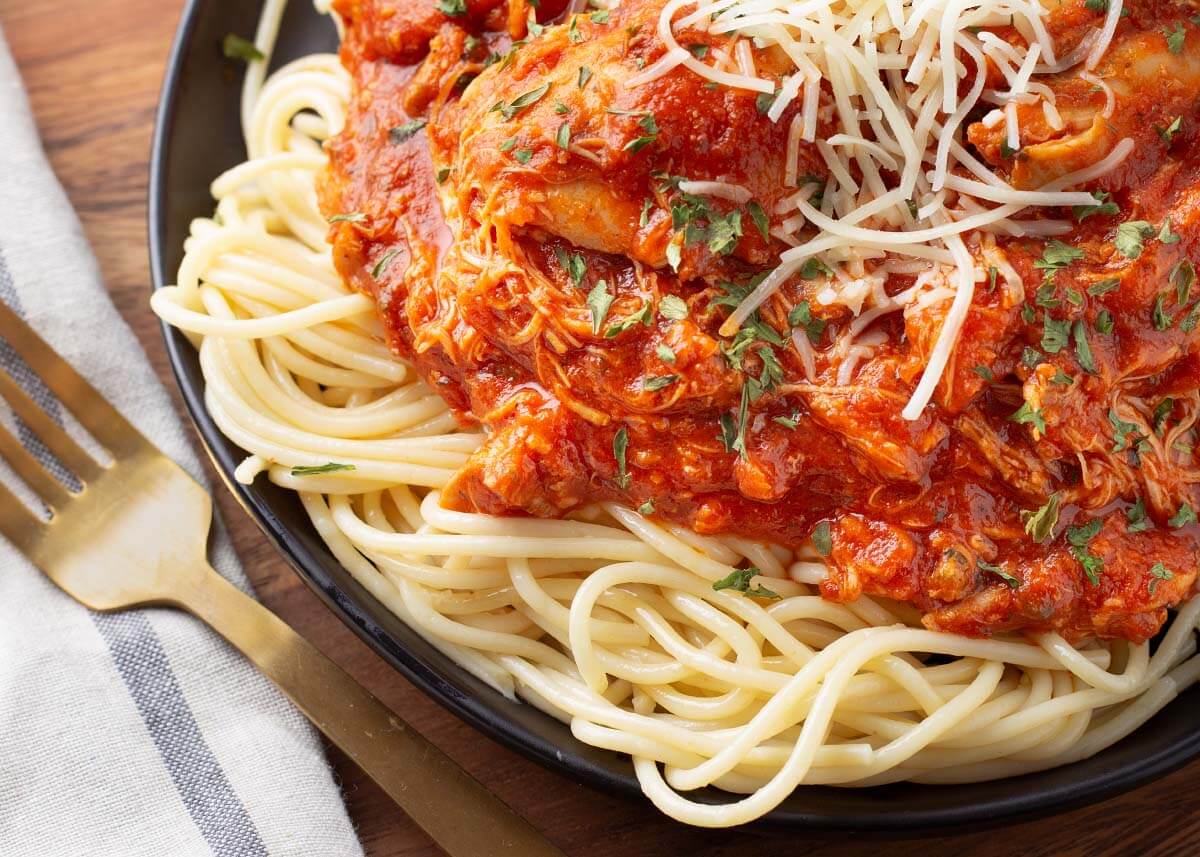 Chicken Cacciatore closeup on a black plate