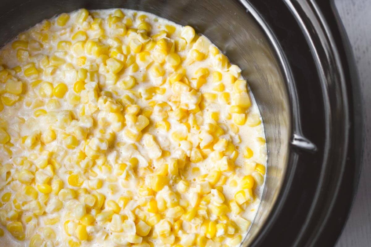 Slow Cooker Creamed Corn in black crock.