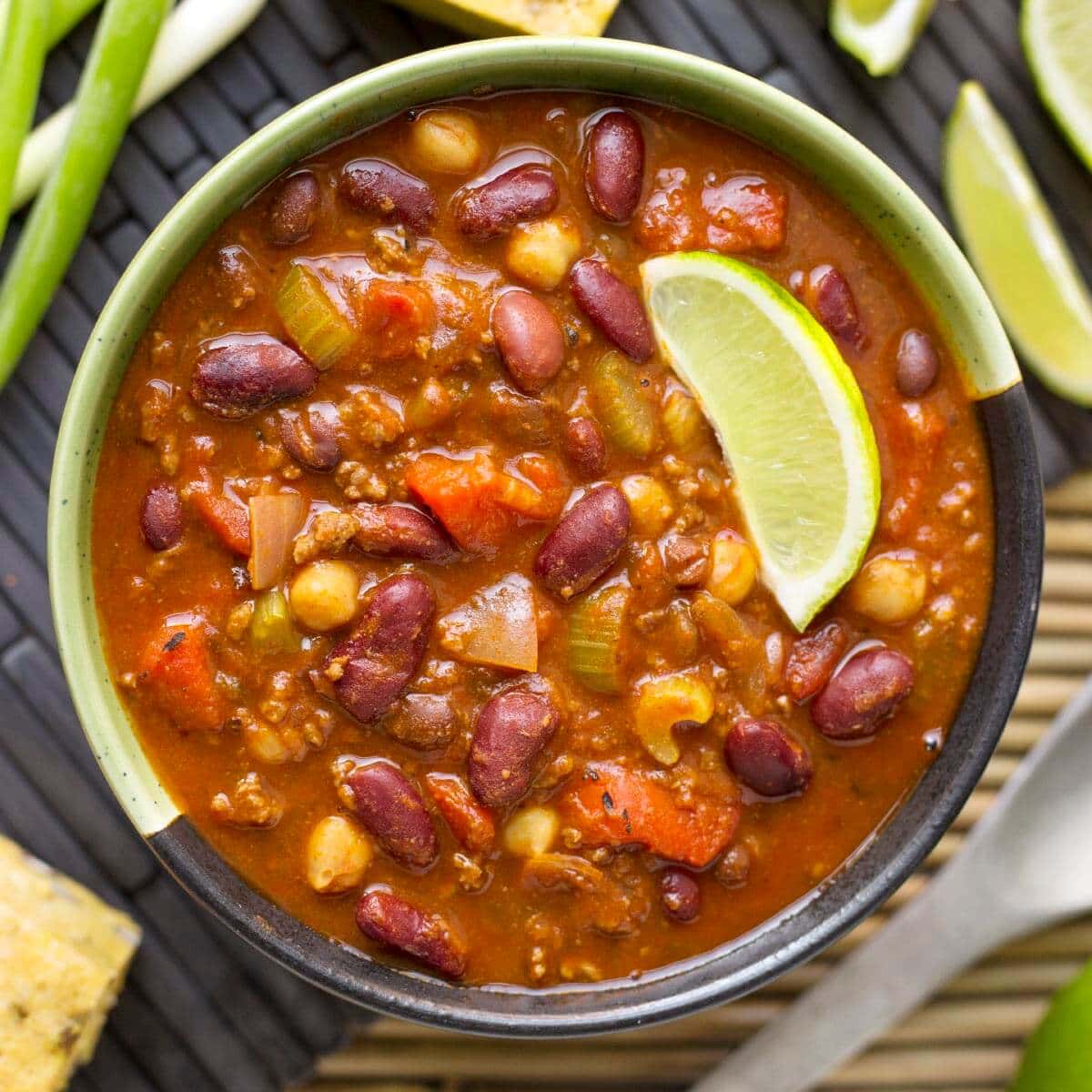 Instant Pot Chili in a bowl with lime wedge.