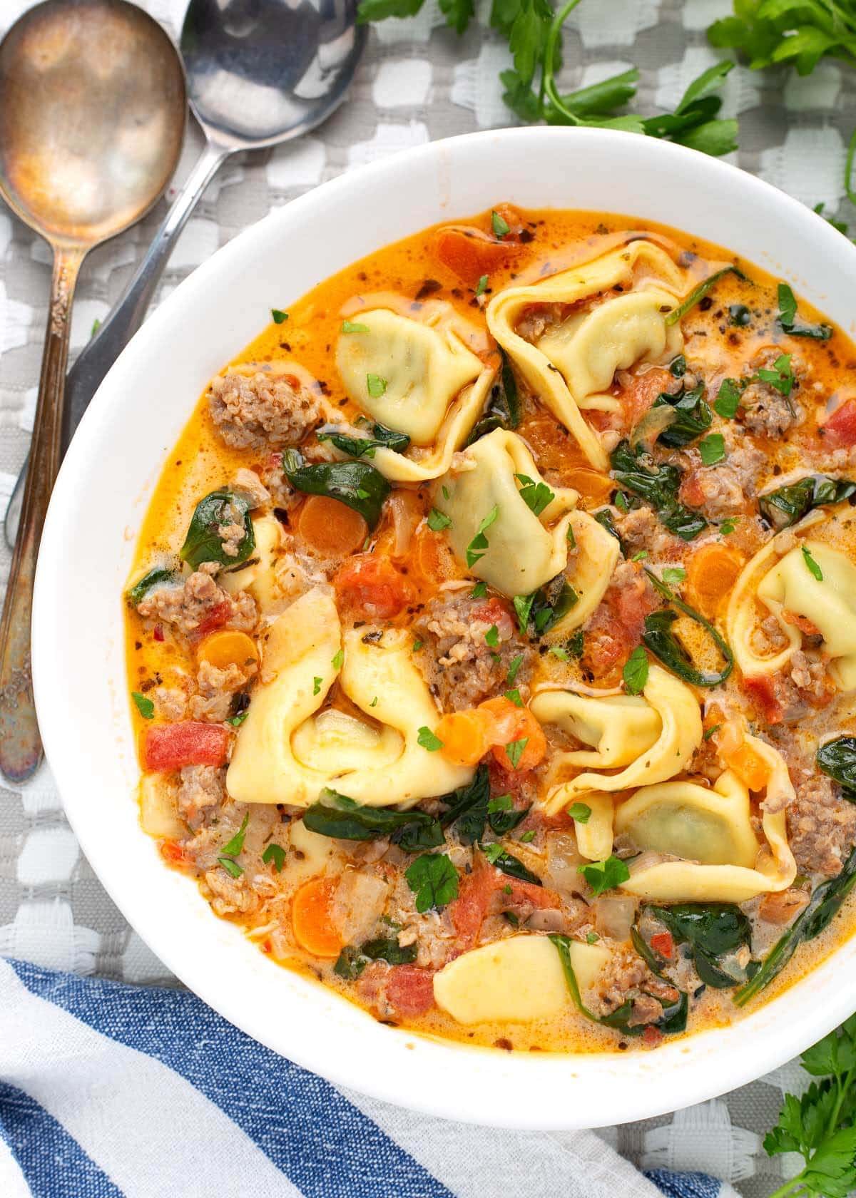 Instant Pot Creamy Tortellini Soup in a white bowl