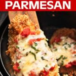 Chicken Parmesan in air fryer basket, on a wood spatula