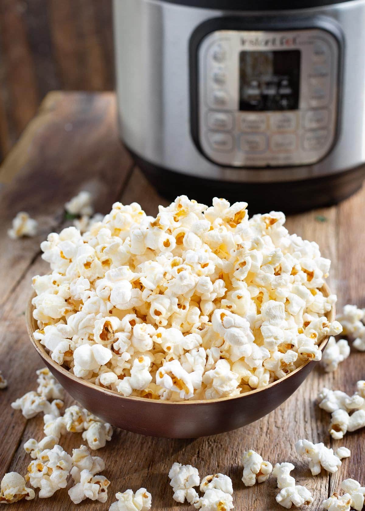 Instant Pot Popcorn in wood bowl in front of IP