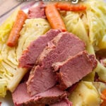 Instant Pot Corned Beef Cabbage on a white plate