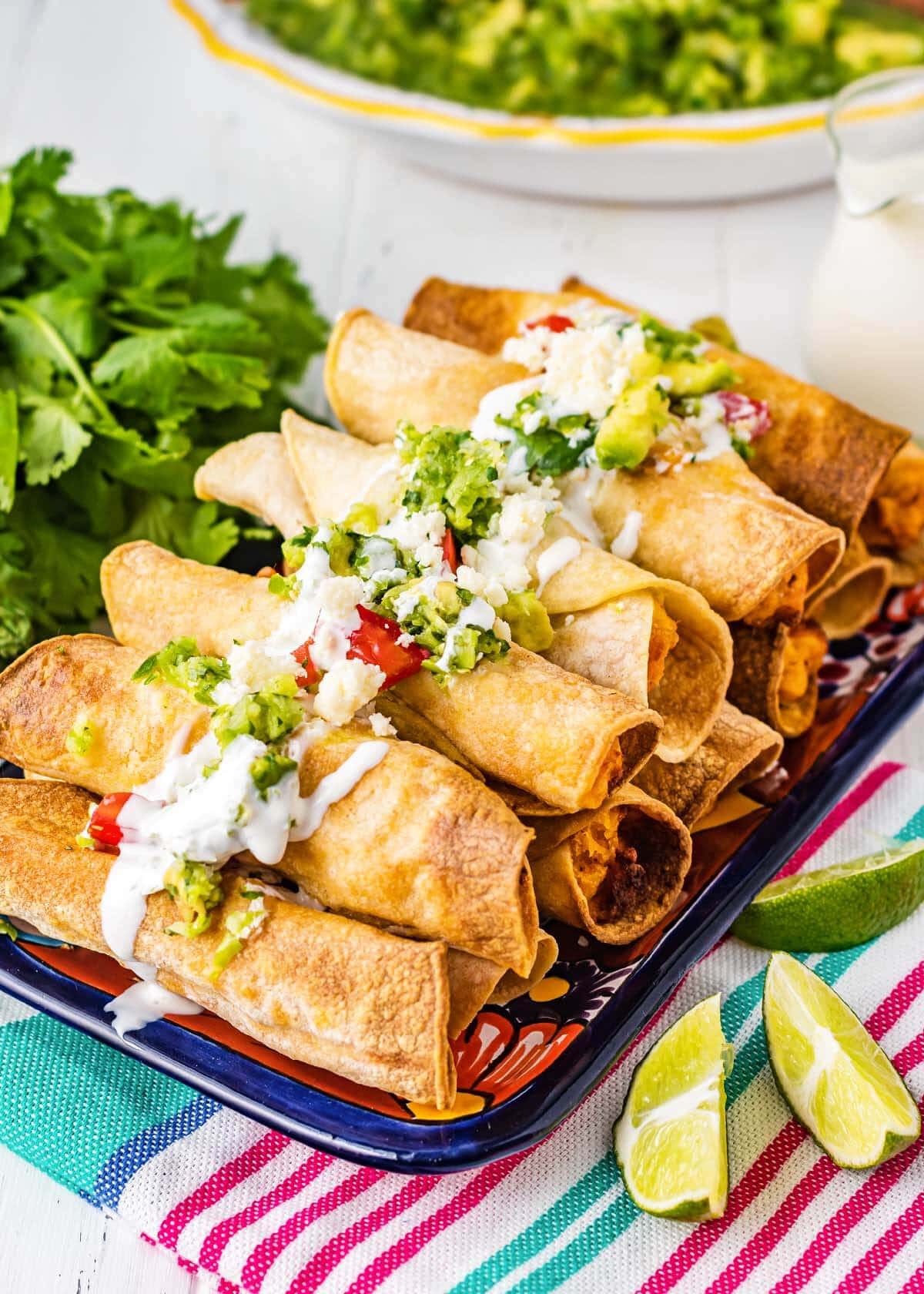 Air Fryer Chicken Taquitos stacked on a tray