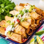 Air Fryer Chicken Taquitos in a stack on platter