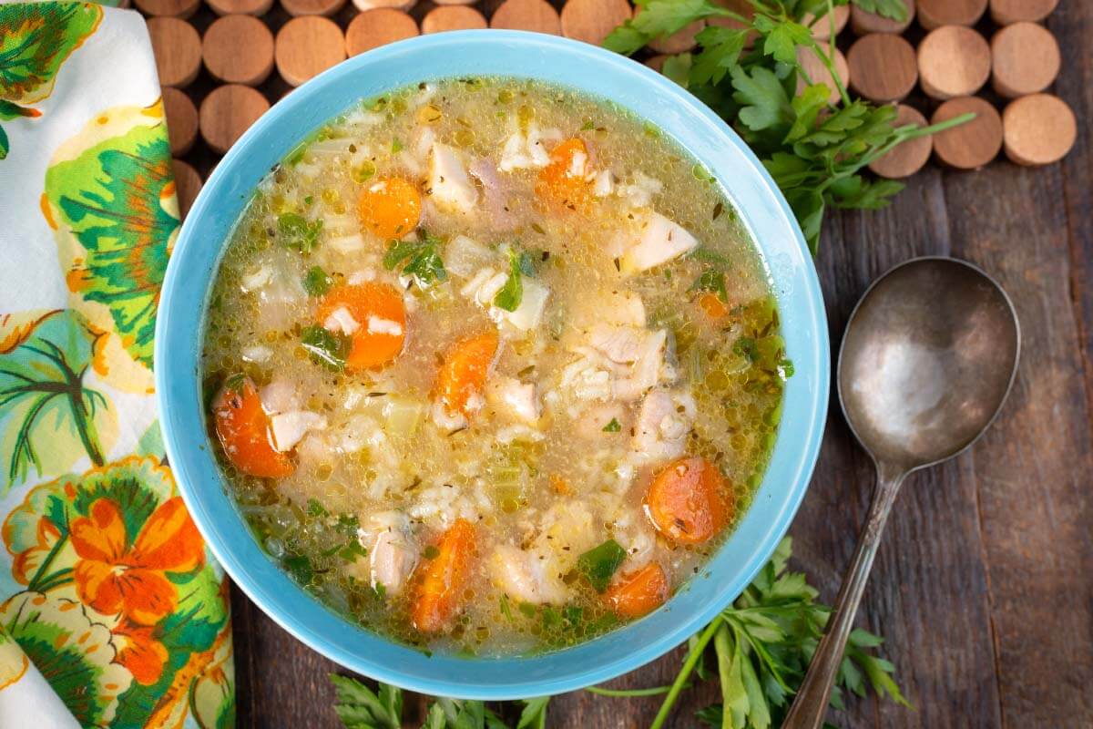 Chicken Rice Soup in a blue bowl.