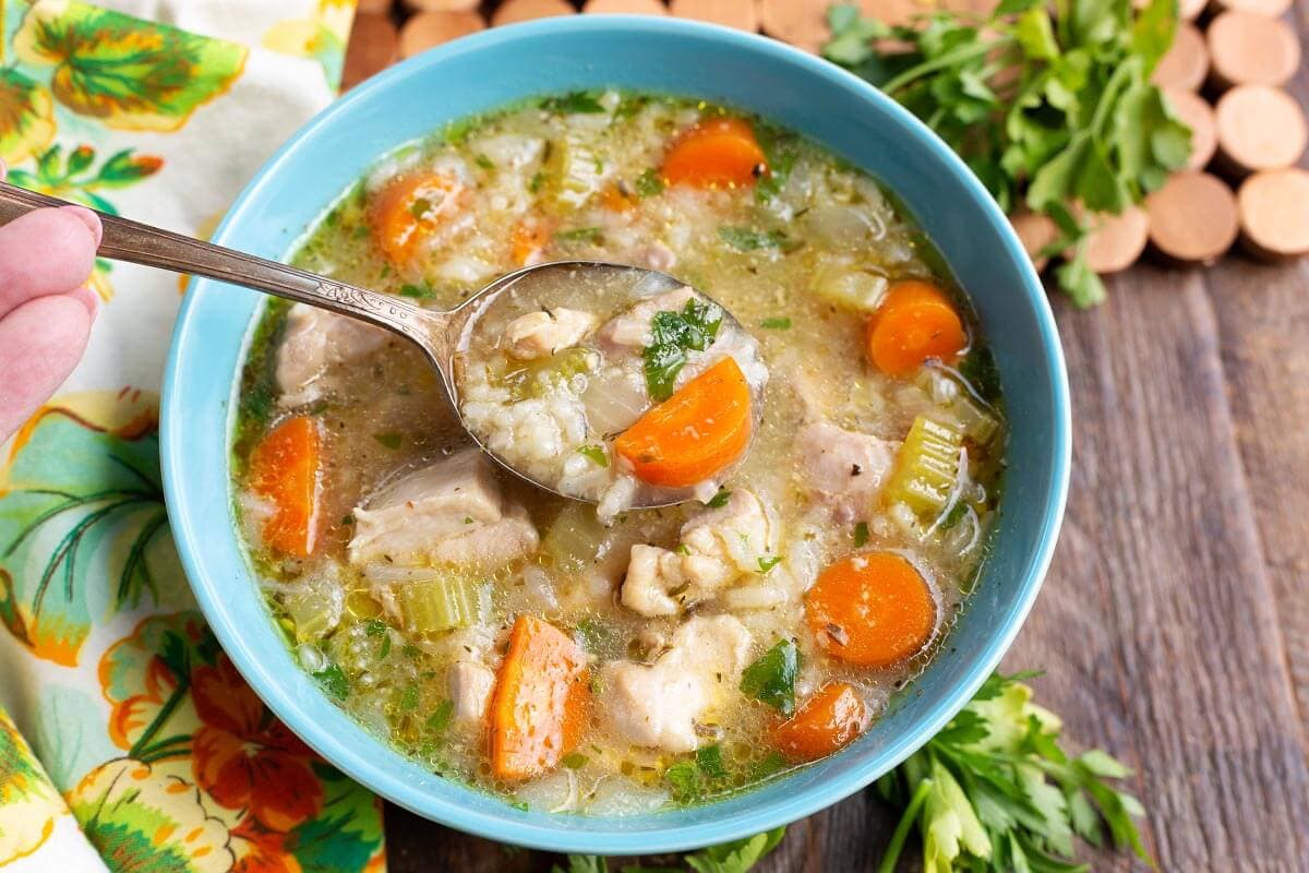 Chicken Rice Soup in a blue bowl.