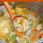 Instant Pot Chicken Rice Soup in instant pot with wood ladle.