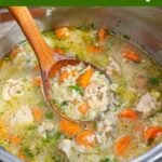 Instant Pot Chicken Rice Soup in instant pot with wood ladle.