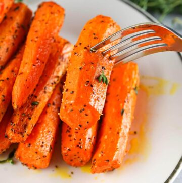 Air Fryer Carrots on plate with fork.