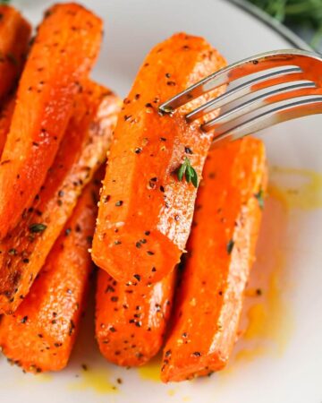 Air Fryer Carrots on plate with fork.