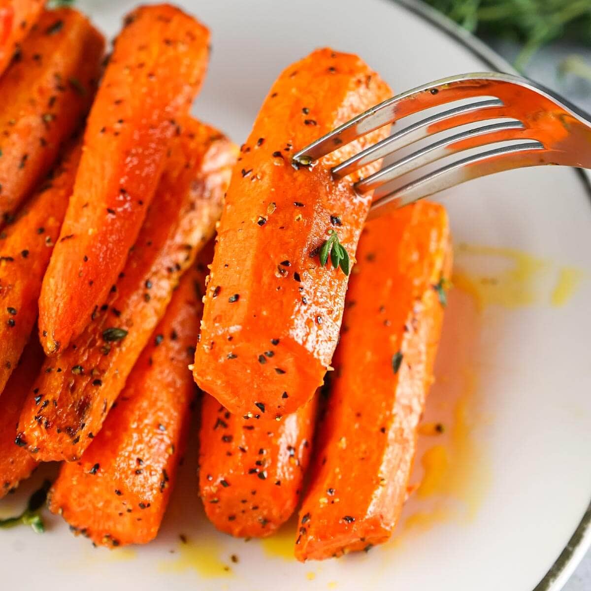 Air Fryer Carrots on plate with fork.