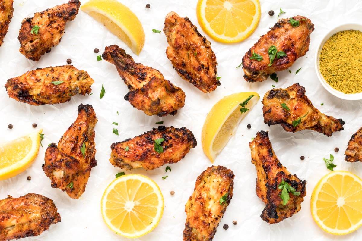 chicken wings on white surface.