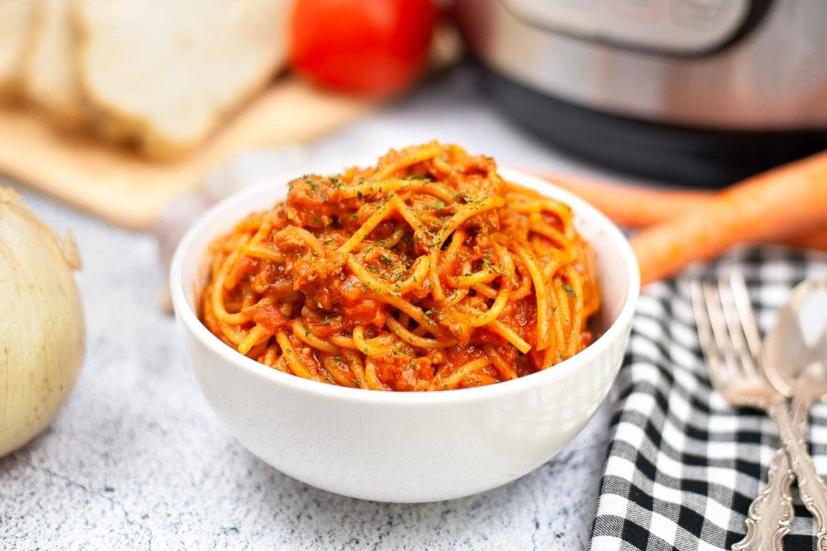 Spaghetti Bolognese in a white bowl.