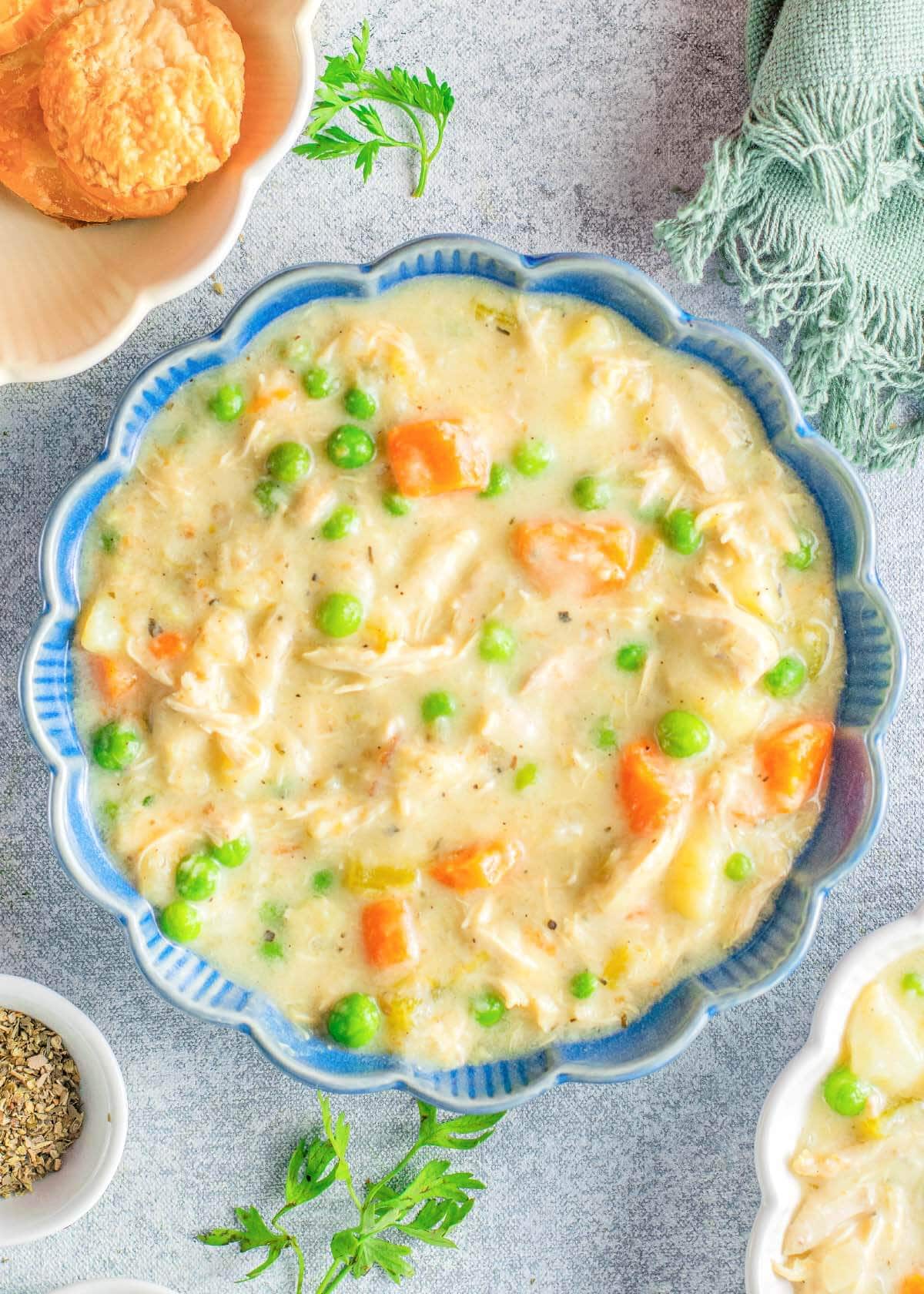 chicken soup in a blue bowl.