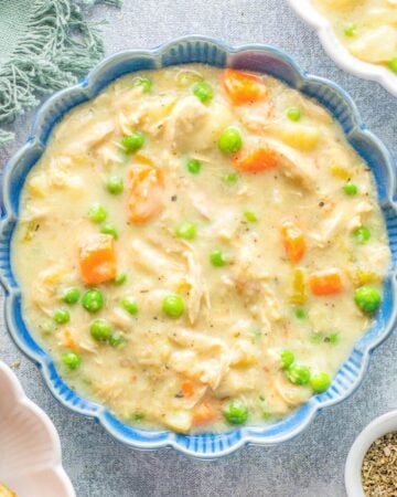 Instant Pot Chicken Pot Pie Soup in a blue bowl.