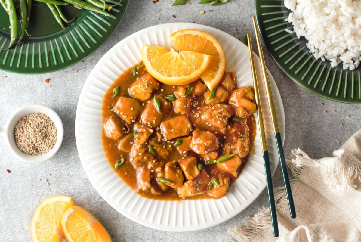 Instant Pot Orange Chicken on a white plate.