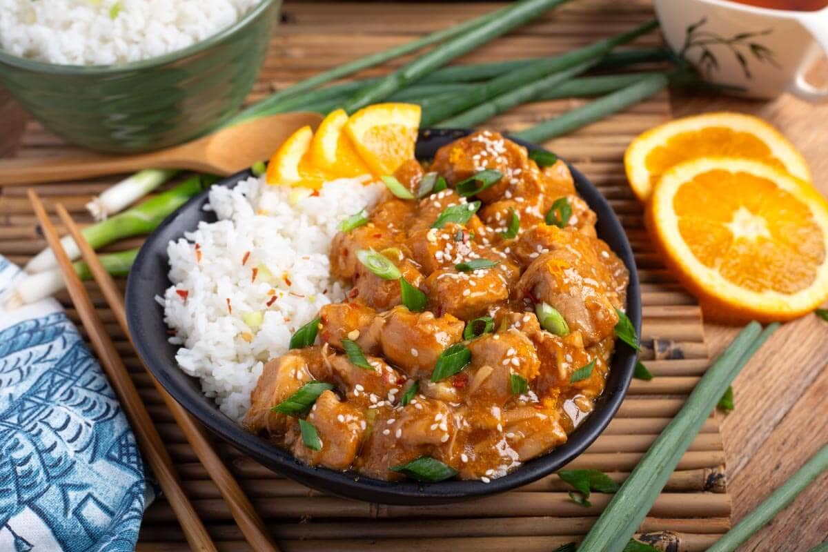 Orange Chicken in black dish.