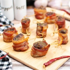 Air Fryer Bacon Wrapped Steak Bites on a board.