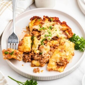 Ravioli Lasagna with Meat Sauce on a white plate