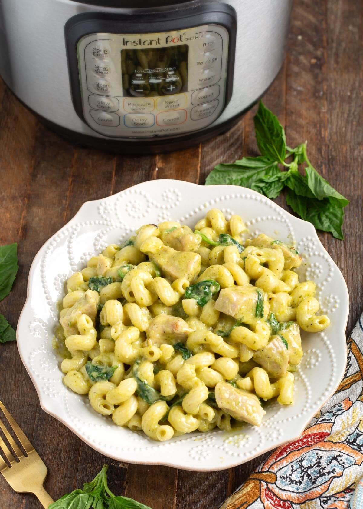 white bowl of Chicken Pesto Pasta, IP behind.
