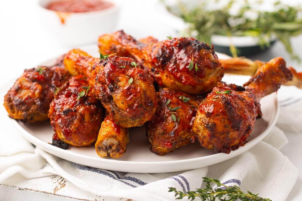 Air Fryer Barbecue Chicken Legs on a white plate.