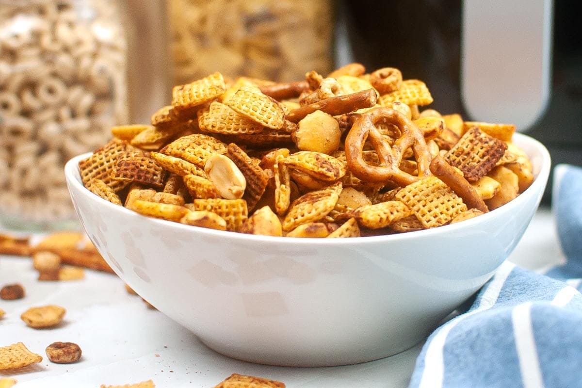 Air Fryer Chex Mix in a white bowl