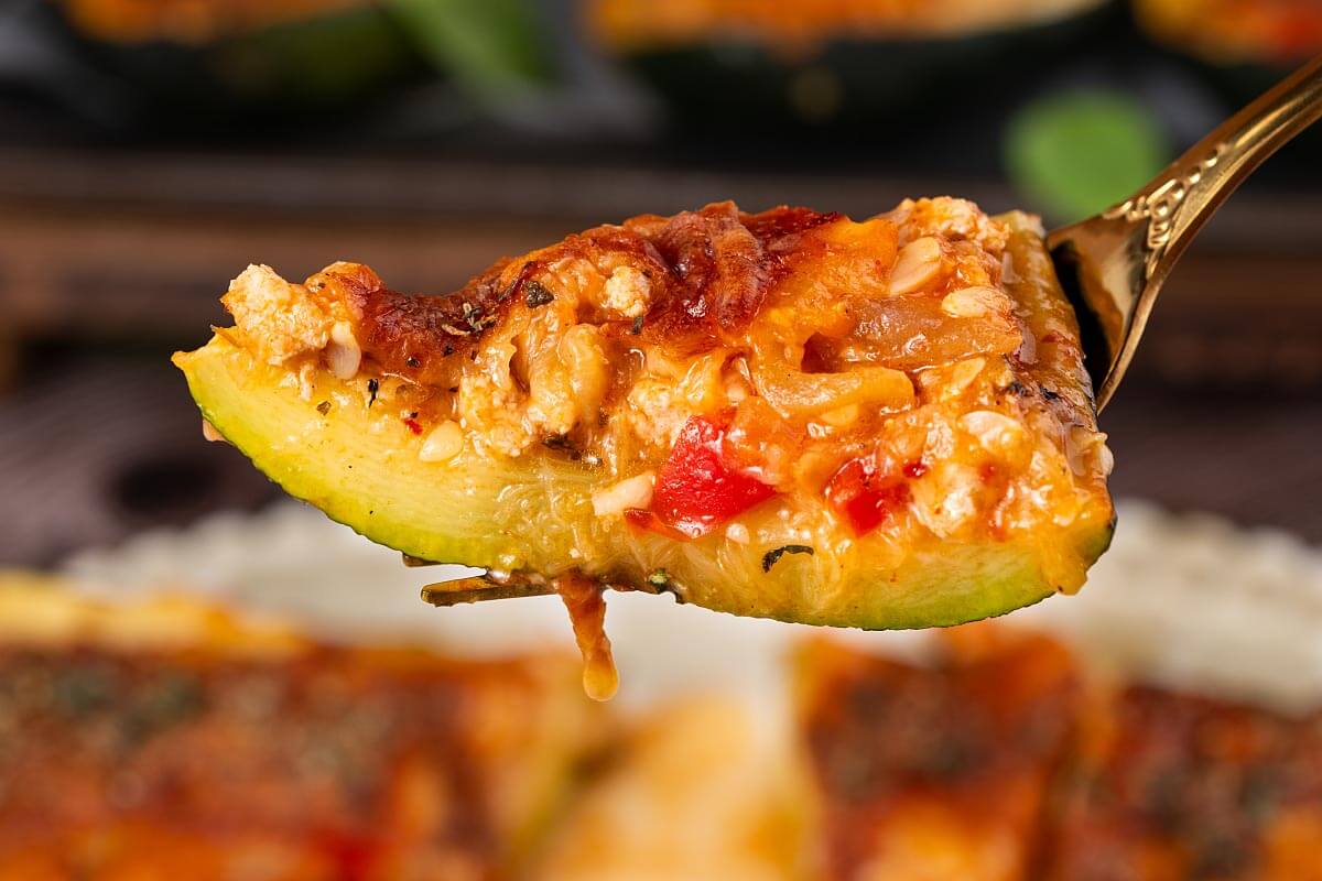 bite of stuffed zucchini on a fork.