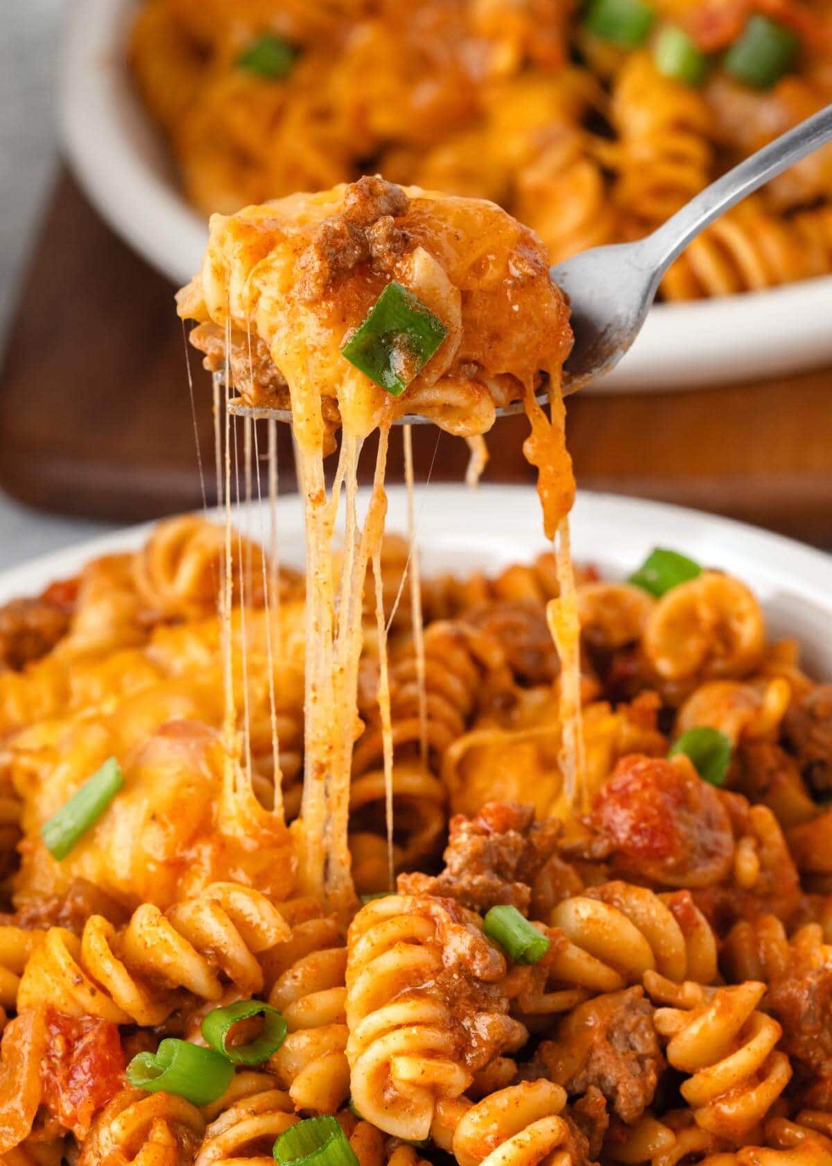 forkful of pasta with cheese pull.
