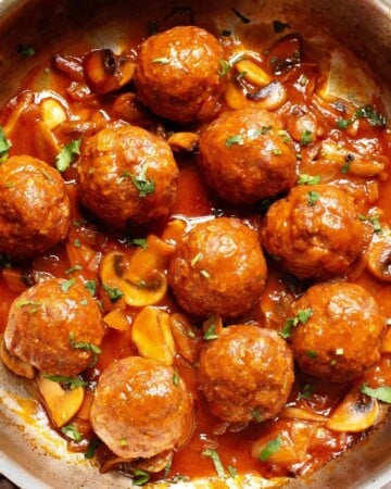 Salisbury Steak Meatballs and gravy in a skillet.