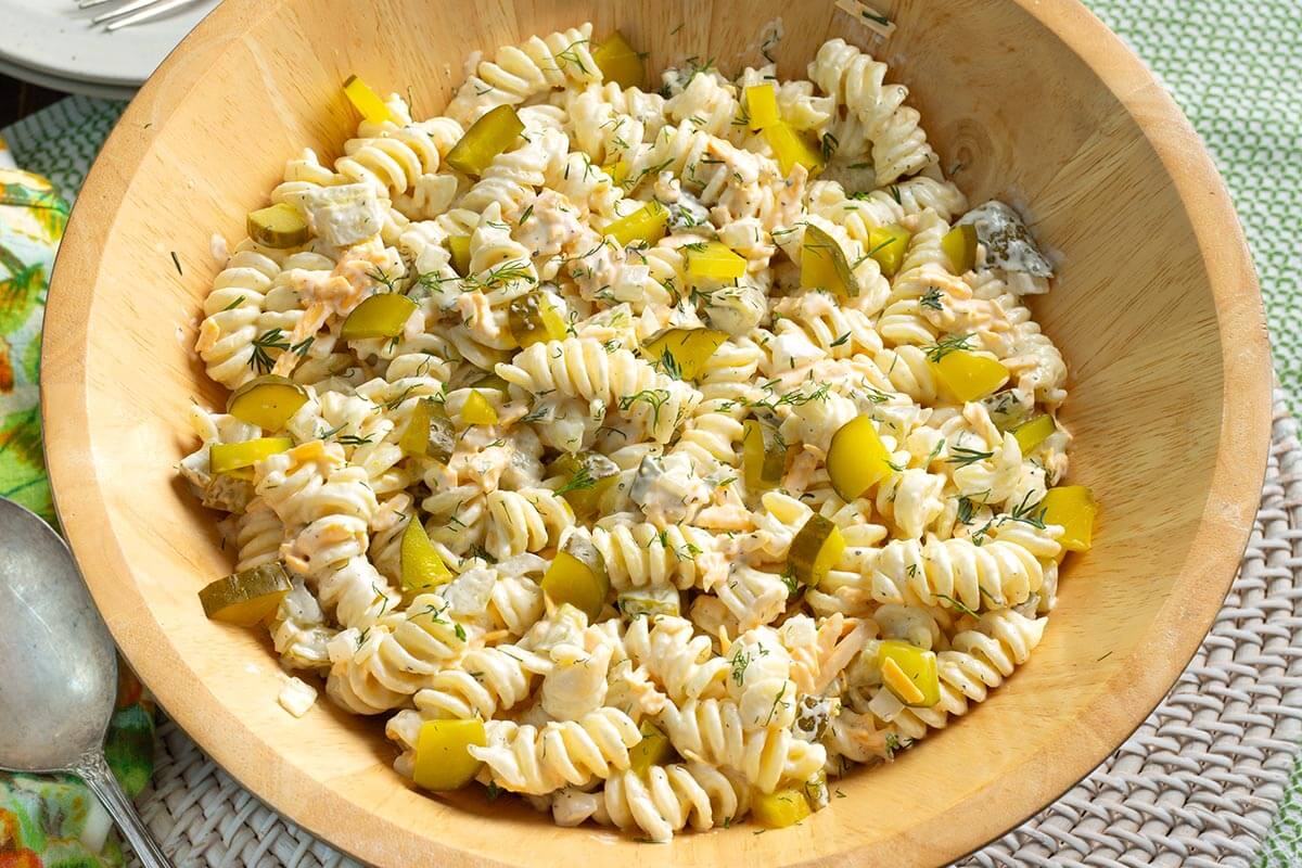 Dill Pickle Pasta Salad in wood bowl.