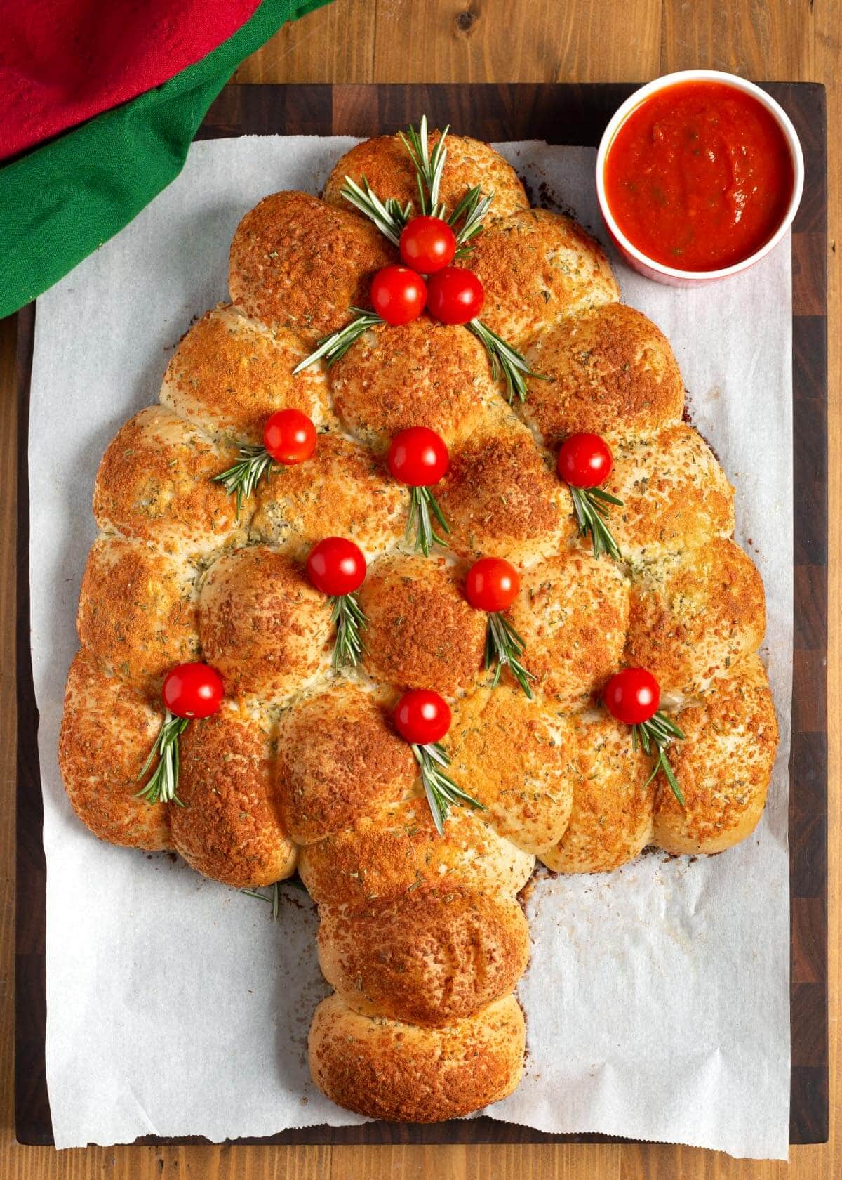 Dinner Roll Christmas Tree Appetizer with tomatoes and rosemary.