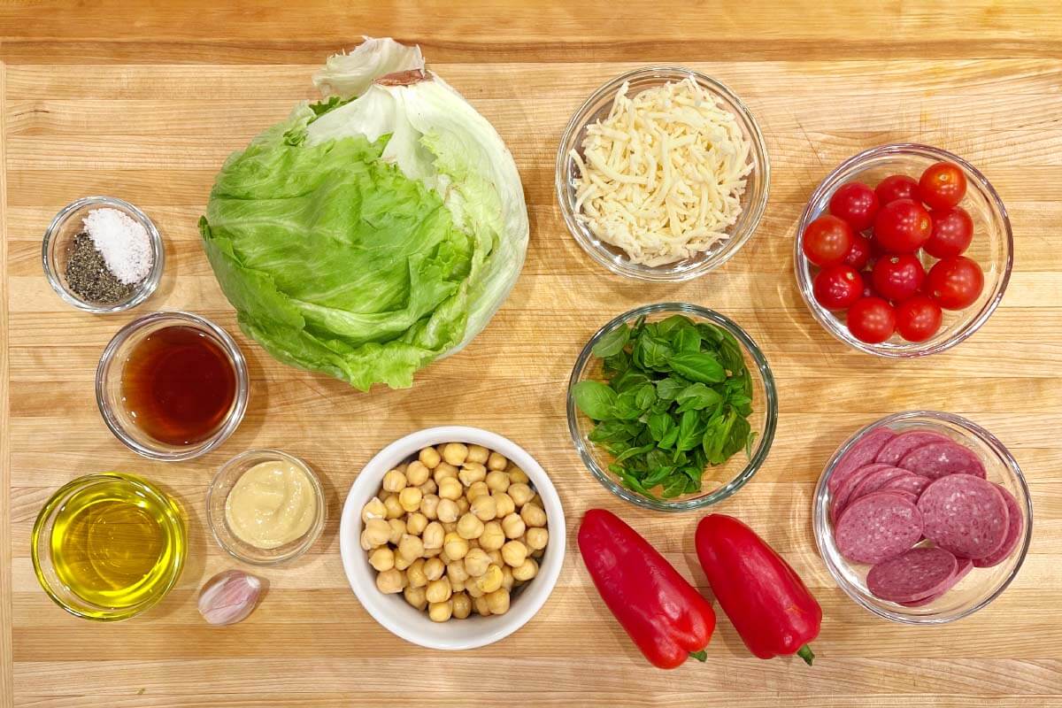 Italian Chopped Salad ingredients on a wood board.