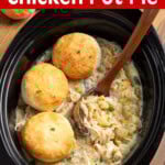 Slow Cooker Chicken Pot Pie in crock with ladle & biscuits