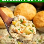 Slow Cooker Chicken Pot Pie in crock on ladle & biscuits