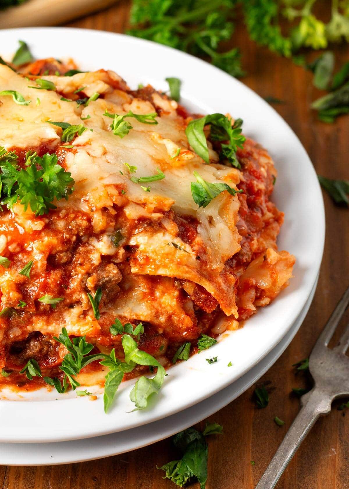 Slow Cooker Lasagna serving on a white plate