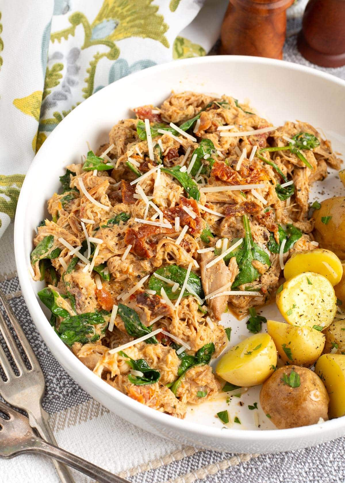 Slow Cooker Marry Me Chicken in a white bowl.