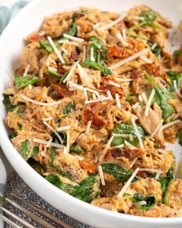 Slow Cooker Marry Me Chicken in a white bowl.