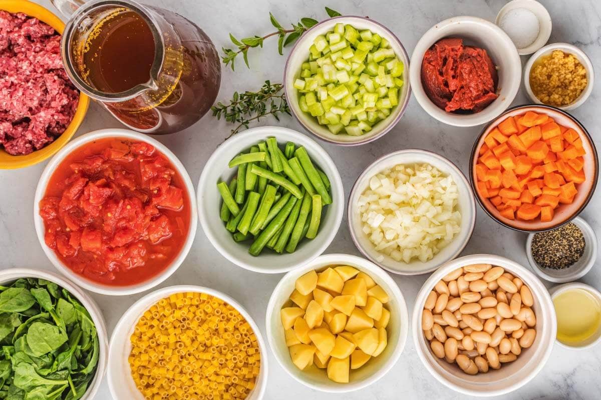 Slow Cooker Minestrone Soup ingredients in bowls.