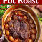 Apple Cider Pot Roast in a dutch oven with potatoes.