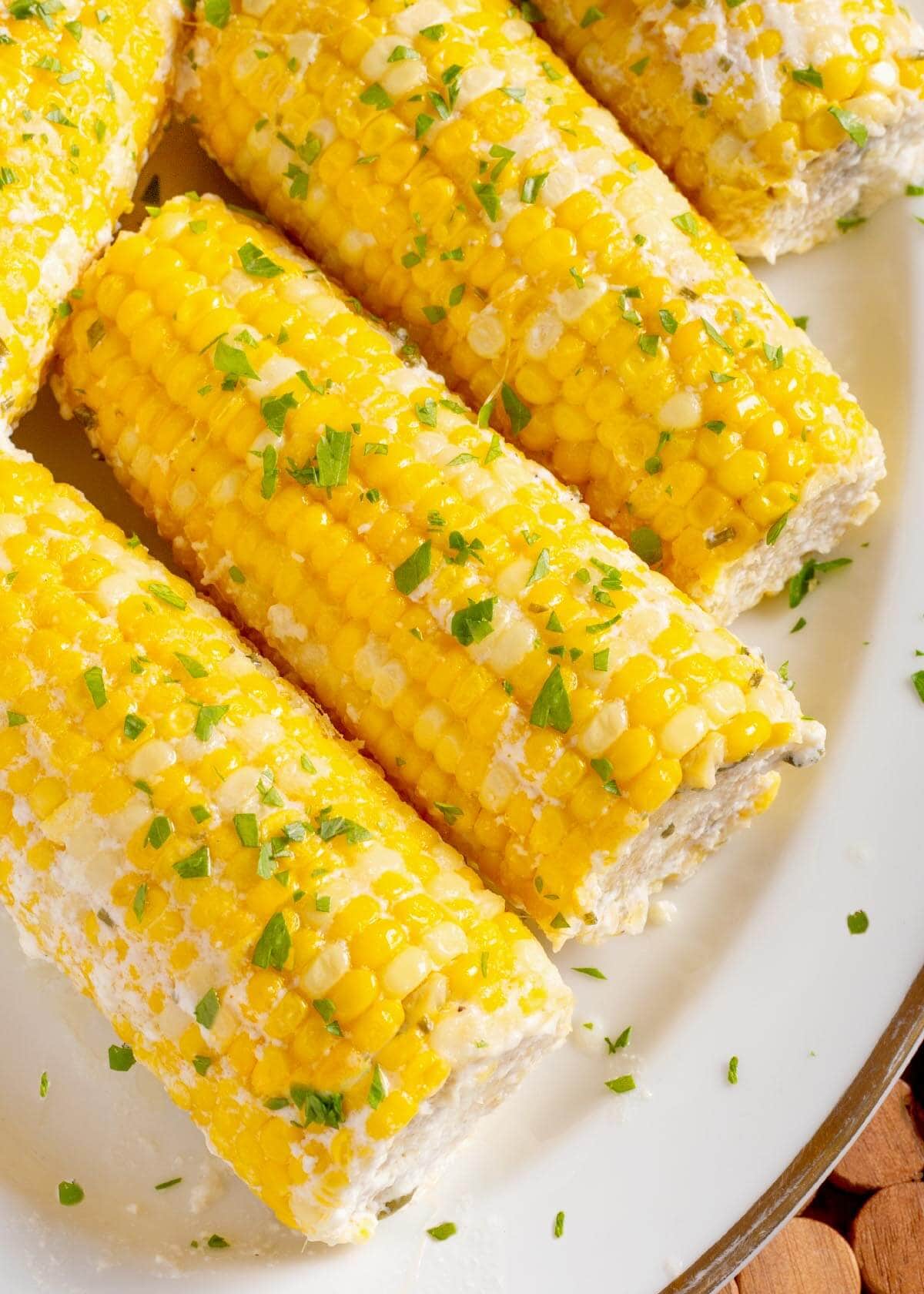 5 Corn on the Cob on a white plate